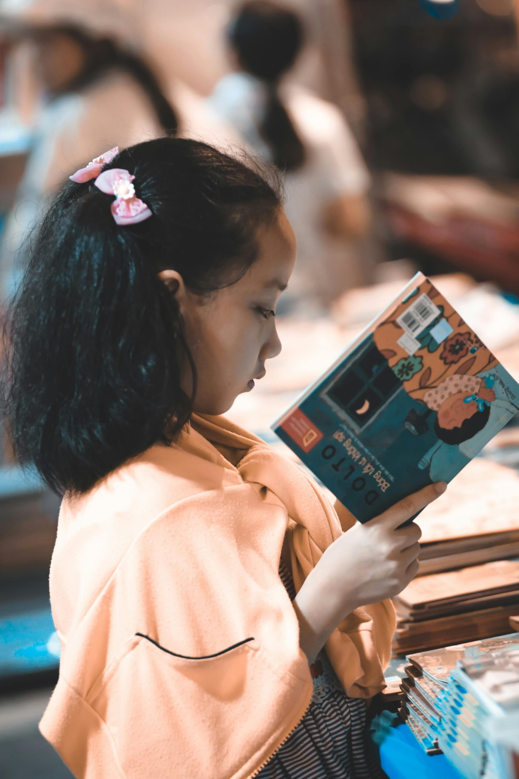 Girl Holding a Story Book